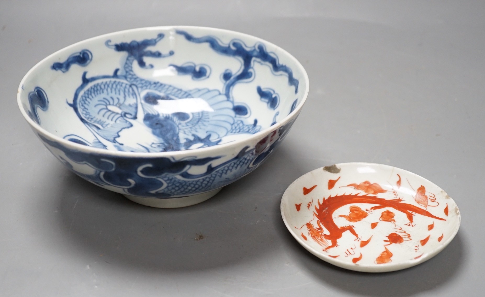 A 19th century Chinese ‘dragon’ bowl, together with a smaller ‘dragon’ dish. Largest 18.5cm diameter